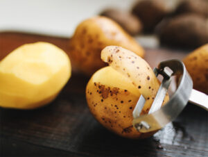 potatoes being peeled